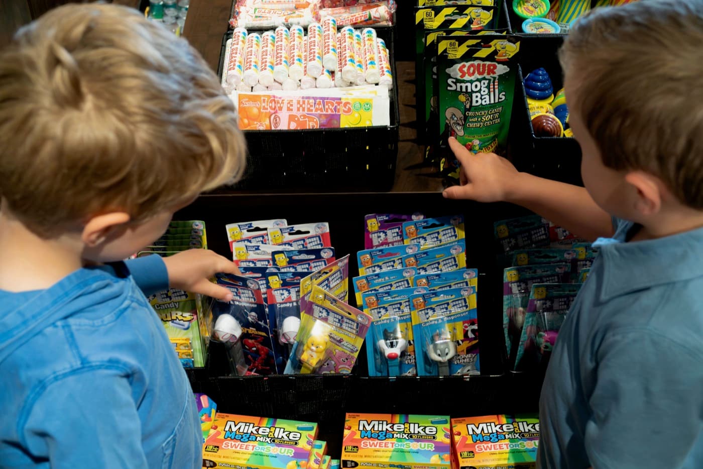 Kids choosing candy from the colourful display