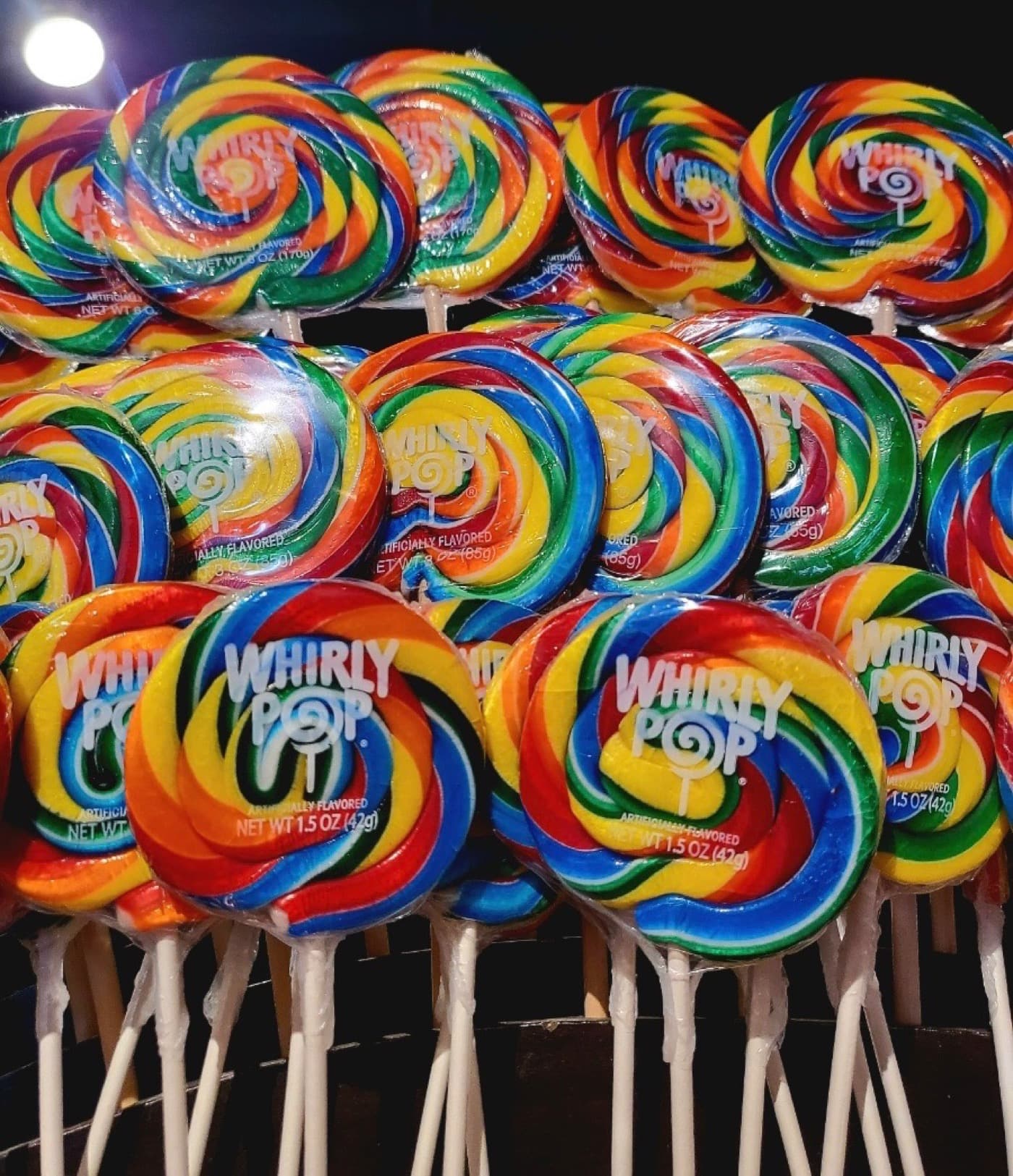 Rainbow Whirly Pops lined up in rows
